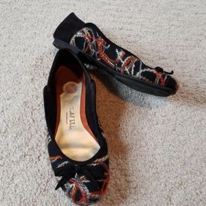 Black flats with colored yarn accents